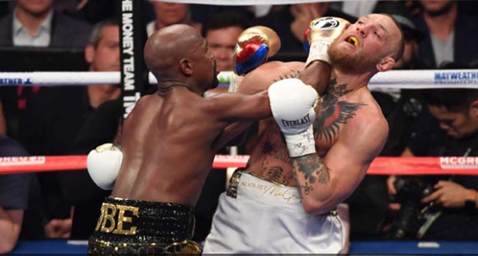 Menang TKO atas McGregor, Mayweather Pensiun dari Tinju